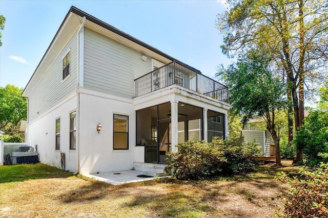 31 Beacon Point Dr, Santa Rosa Beach, FL 32459 - rear view of property with a balcony, ceiling fan, and stucco siding