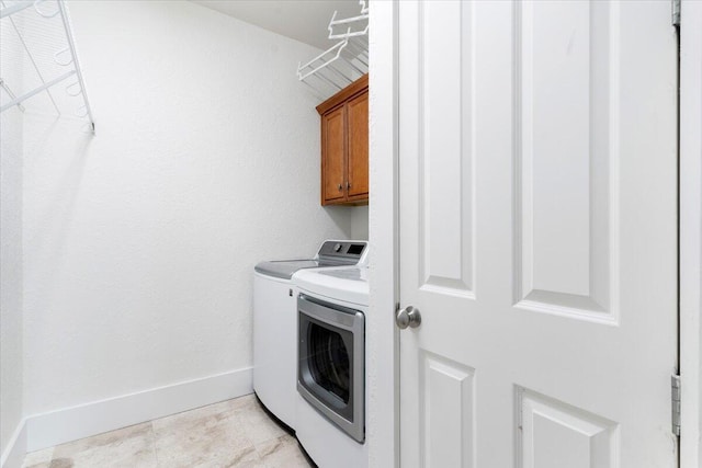 31 Beacon Point Dr, Santa Rosa Beach, FL 32459 - washroom with washing machine and clothes dryer and cabinet space