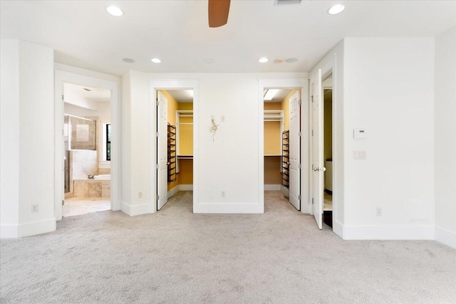 31 Beacon Point Dr, Santa Rosa Beach, FL 32459 - unfurnished bedroom featuring a spacious closet, light colored carpet, recessed lighting, a closet, and ensuite bath