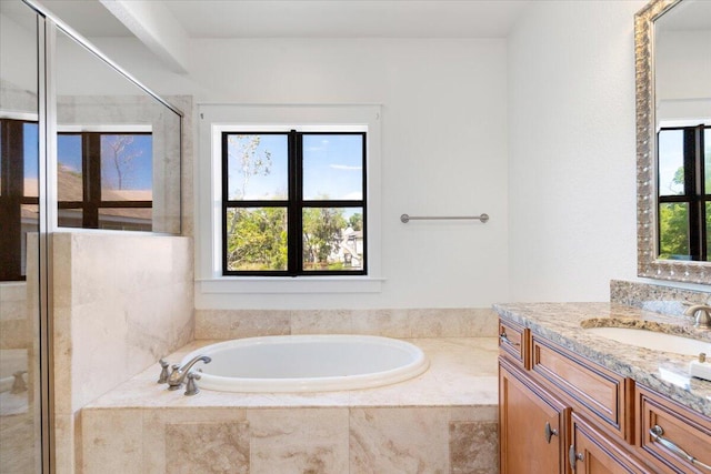 31 Beacon Point Dr, Santa Rosa Beach, FL 32459 - bathroom with vanity, a garden tub, and a stall shower