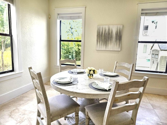 31 Beacon Point Dr, Santa Rosa Beach, FL 32459 - dining space with a textured wall and healthy amount of natural light
