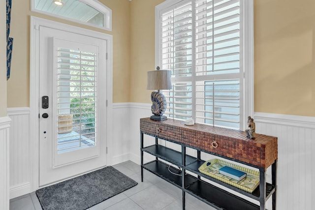 doorway to outside featuring light tile patterned floors