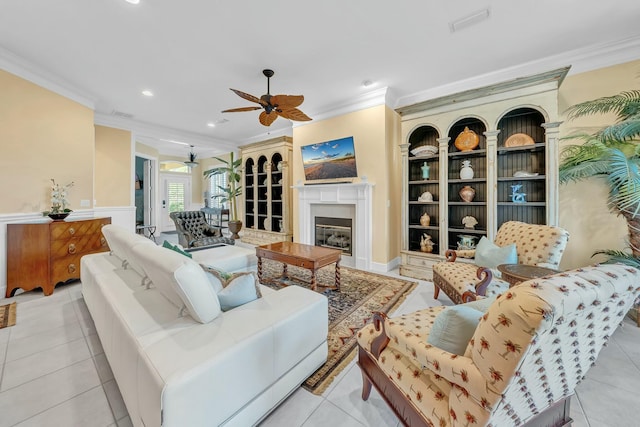 living room with light tile patterned floors and ornamental molding