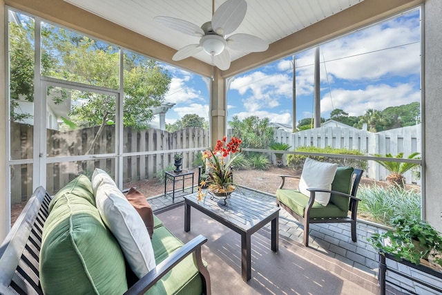 sunroom / solarium with ceiling fan