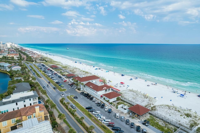 birds eye view of property with a water view and a view of the beach