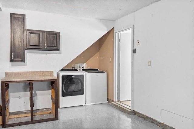 clothes washing area featuring a textured ceiling and independent washer and dryer