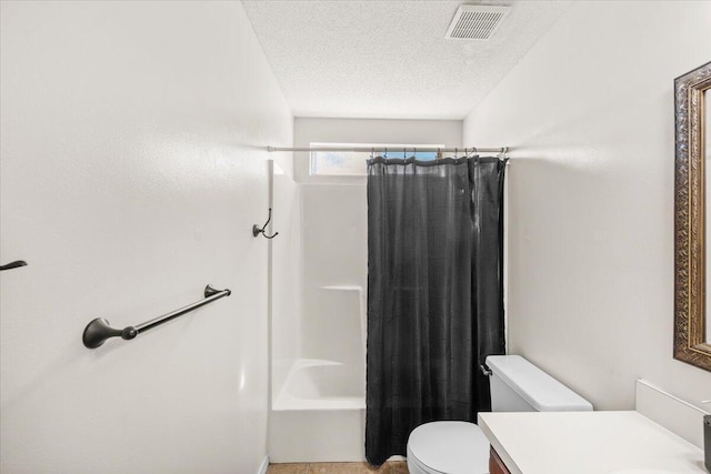 full bathroom featuring toilet, a textured ceiling, shower / bath combo, and vanity