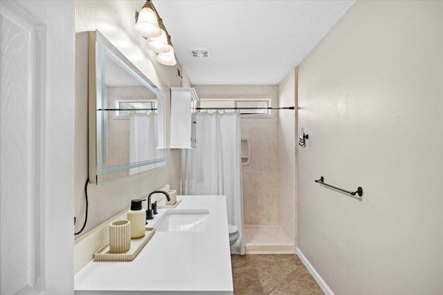 bathroom featuring toilet, tile patterned flooring, a shower with shower curtain, and a textured ceiling