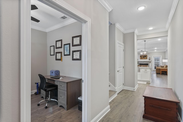 office area featuring ornamental molding, ceiling fan, and light hardwood / wood-style floors