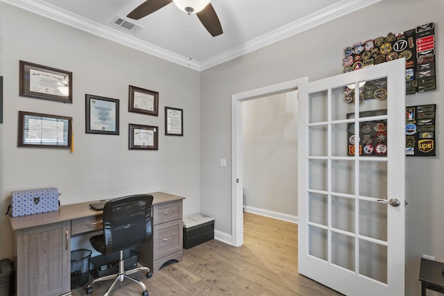 office space with crown molding, ceiling fan, and light hardwood / wood-style floors