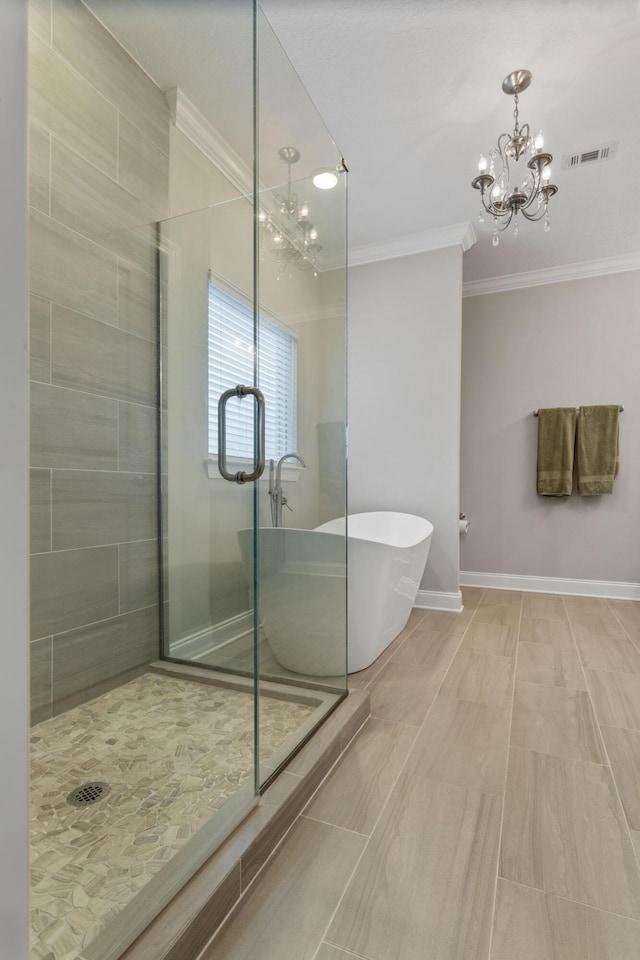 bathroom with shower with separate bathtub, ornamental molding, and an inviting chandelier