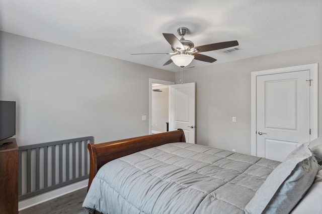 bedroom featuring ceiling fan and wood-type flooring