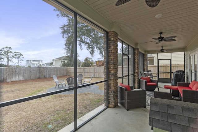 sunroom with ceiling fan and a healthy amount of sunlight