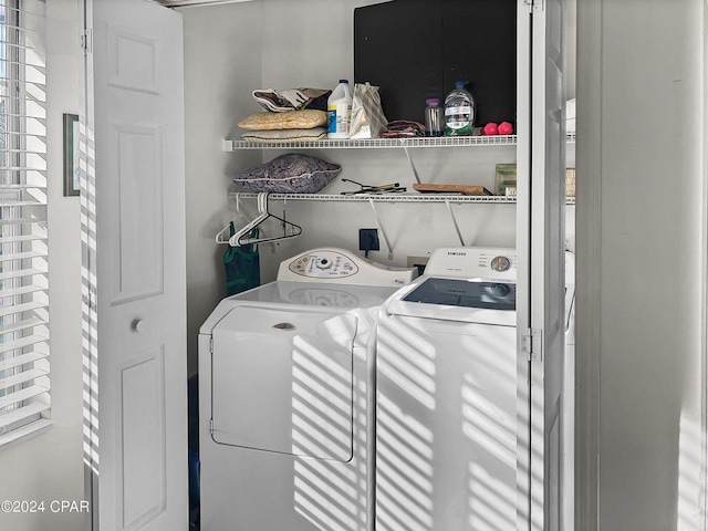 clothes washing area with laundry area and independent washer and dryer