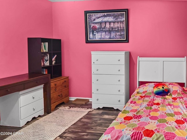 bedroom featuring wood finished floors