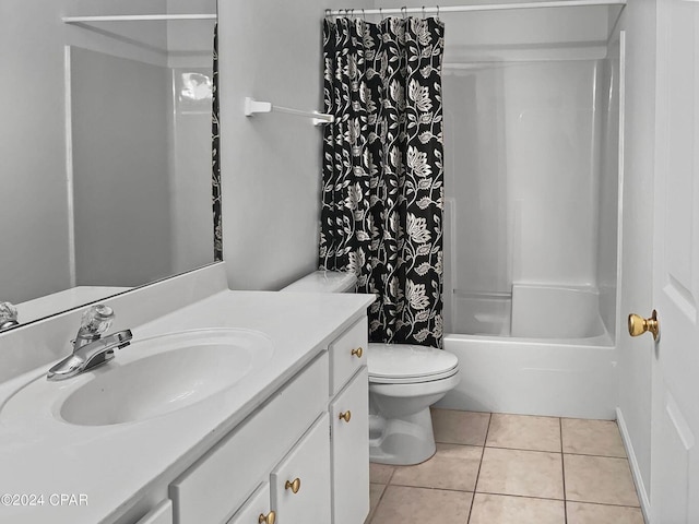 full bath featuring vanity, tile patterned floors, toilet, and shower / bath combo