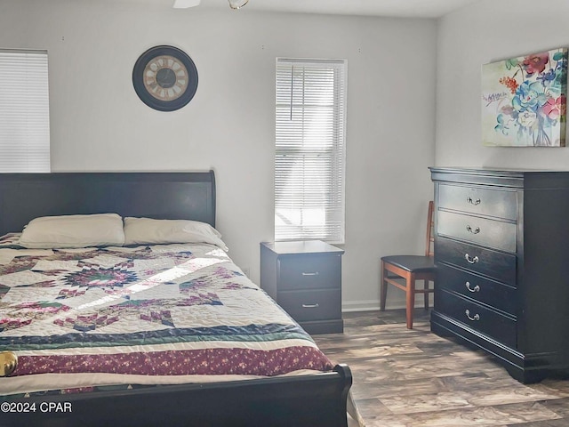 bedroom featuring wood finished floors