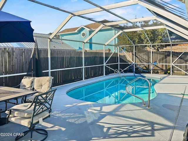 view of swimming pool featuring a fenced in pool, a patio, and a fenced backyard