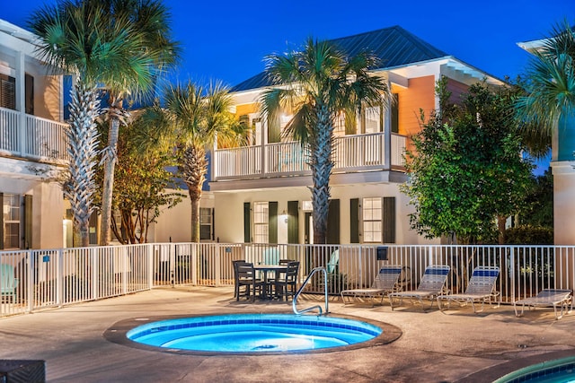 view of pool featuring a community hot tub and a patio