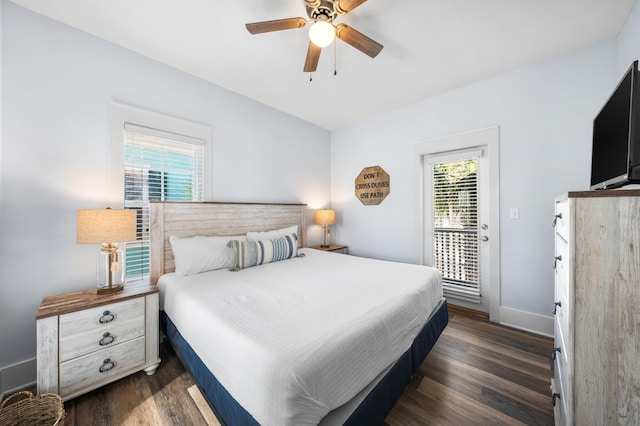 bedroom featuring access to outside, dark hardwood / wood-style floors, and ceiling fan