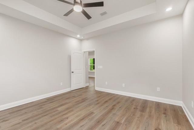 5848 Phillip Rd, Crestview, FL 32539 - spare room featuring recessed lighting, a ceiling fan, light wood-type flooring, baseboards, and a tray ceiling