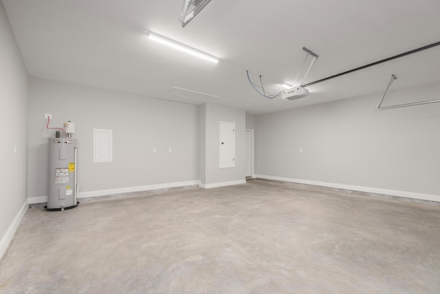 5848 Phillip Rd, Crestview, FL 32539 - garage featuring electric water heater, a garage door opener, and baseboards