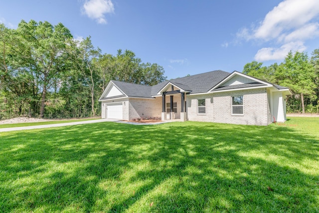 5848 Phillip Rd, Crestview, FL 32539 - ranch-style home featuring brick siding, a front lawn, a garage, and driveway