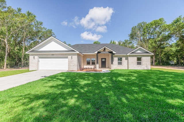 5848 Phillip Rd, Crestview, FL 32539 - view of front of property featuring an attached garage, brick siding, a front lawn, and concrete driveway