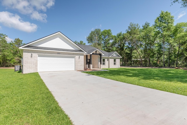 5848 Phillip Rd, Crestview, FL 32539 - ranch-style home featuring an attached garage, brick siding, driveway, and a front yard
