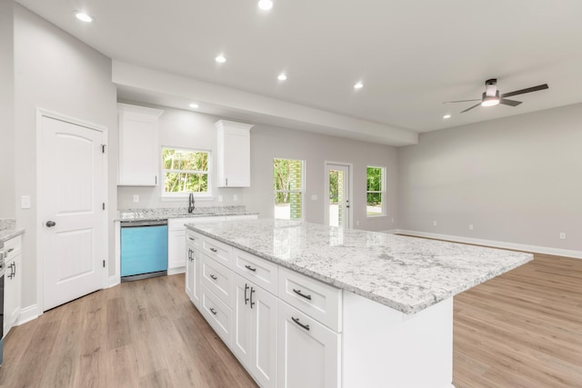 5848 Phillip Rd, Crestview, FL 32539 - kitchen with dishwashing machine, a center island, light wood-style floors, ceiling fan, and recessed lighting