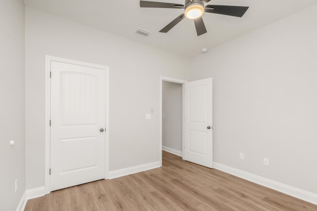 5848 Phillip Rd, Crestview, FL 32539 - unfurnished bedroom featuring light wood-style flooring, baseboards, and ceiling fan