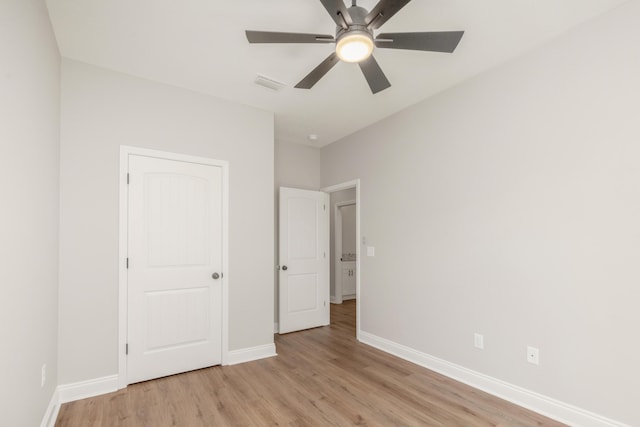 5848 Phillip Rd, Crestview, FL 32539 - unfurnished bedroom with light wood-type flooring, baseboards, and a ceiling fan