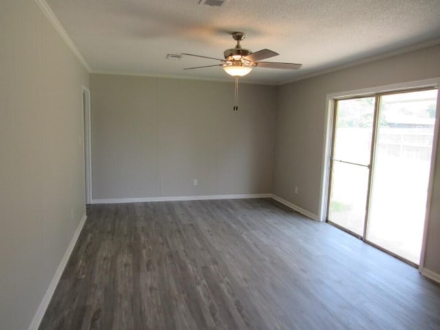 spare room with ceiling fan, dark wood-type flooring, a textured ceiling, and ornamental molding