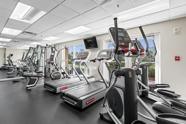 exercise room with a paneled ceiling