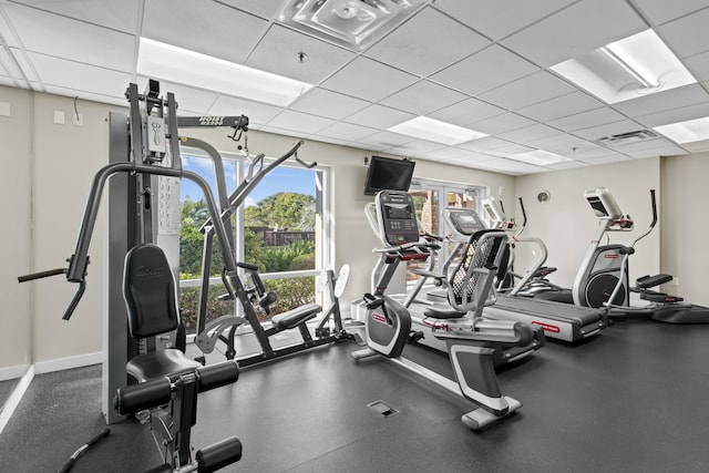 exercise room featuring a drop ceiling