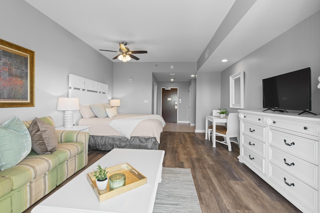 bedroom with ceiling fan and dark wood-type flooring