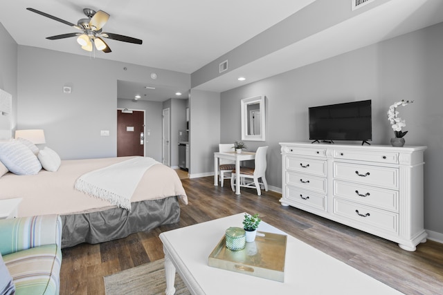 bedroom featuring ceiling fan and dark hardwood / wood-style flooring