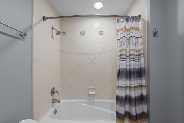 bathroom featuring shower / tub combo with curtain