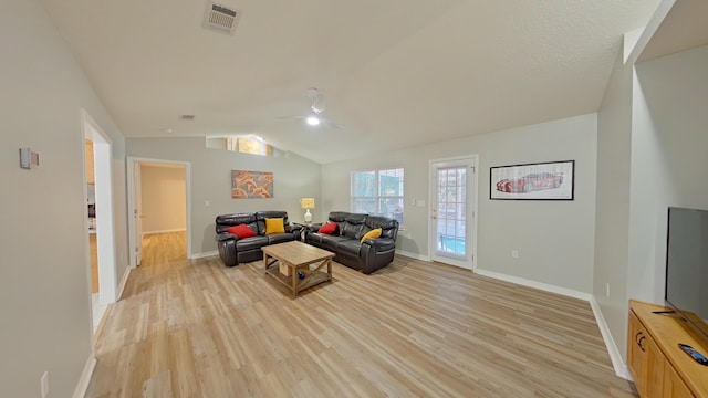 living room featuring light hardwood / wood-style floors and lofted ceiling