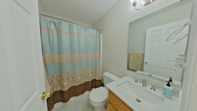 bathroom with toilet, a textured ceiling, tile patterned flooring, and vanity