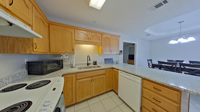 kitchen featuring kitchen peninsula, sink, light tile patterned flooring, white appliances, and a chandelier