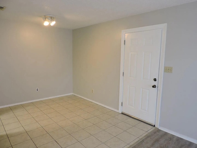 view of tiled spare room