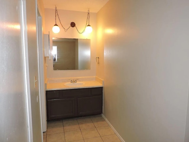 bathroom featuring tile patterned flooring and vanity