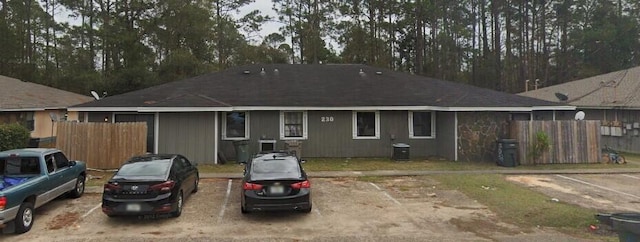 back of house featuring cooling unit