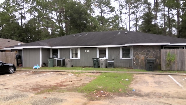 rear view of house with cooling unit