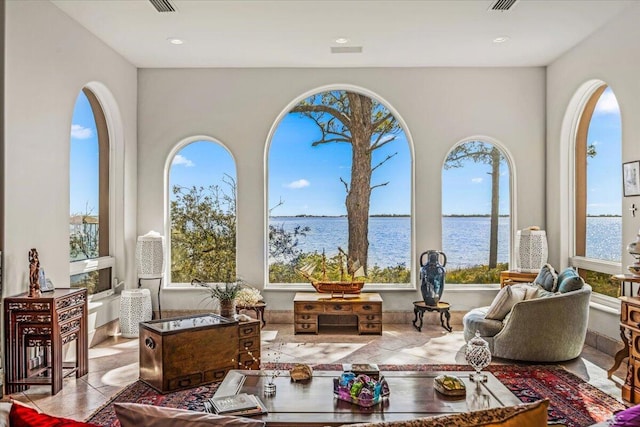 sunroom with a water view