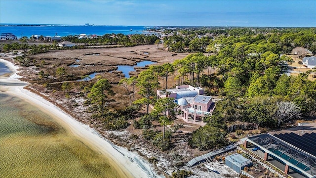 bird's eye view featuring a water view and a view of the beach