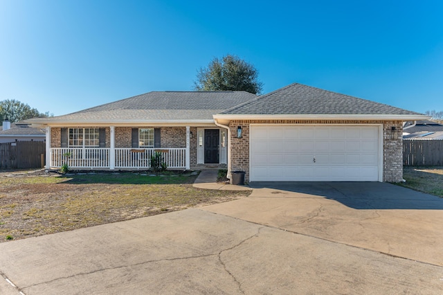 single story home featuring a garage and a porch