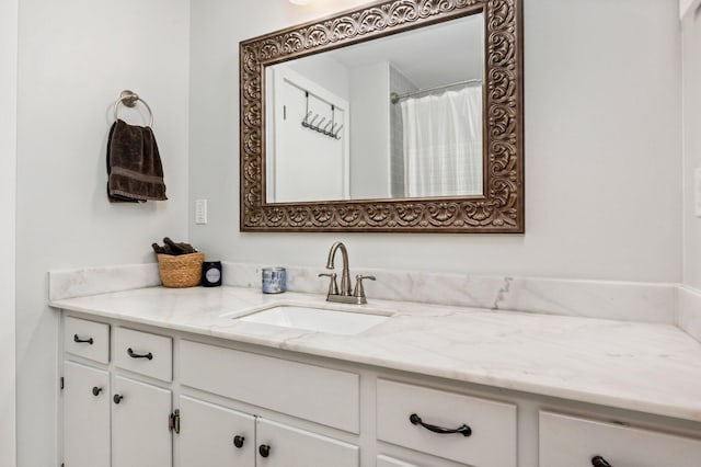 bathroom with vanity and curtained shower