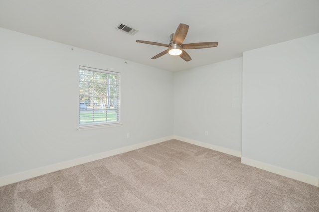 carpeted empty room featuring ceiling fan